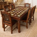 Wooden dining table with colorful ceramic tile top and six chairs