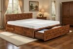 Premium Shahi Palace solid wood king size bed featuring an elegant high headboard and functional integrated storage drawers for a luxury bedroom.